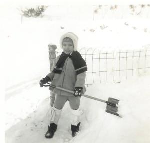 Industrious manual laborer with old diapers wrapped around boot tops.