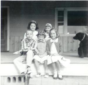 On our front porch. Front: David, Karen (Kill's younger sister), Connie Back: Kathy, me, Wolfy